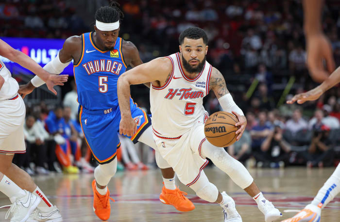 Houston Rockets guard Fred VanVleet (5) drives with the ball as Oklahoma City Thunder guard Luguentz Dort (5) defends during the first quarter at Toyota Center.